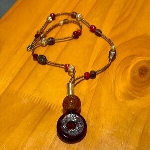 Glass bead pendant necklace.